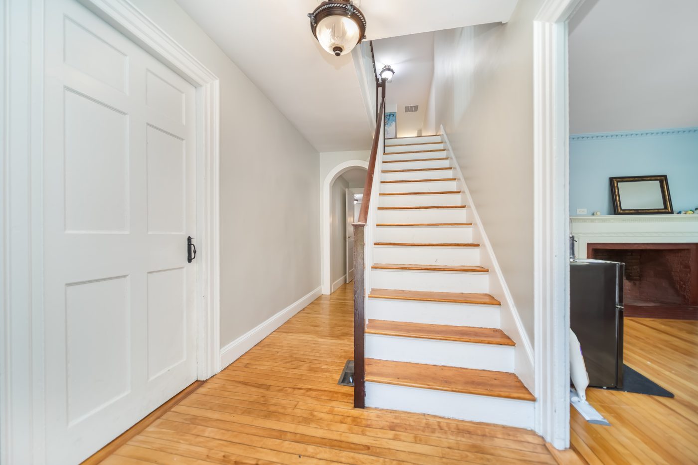 Stair hall with a painted staircase and panelled doors